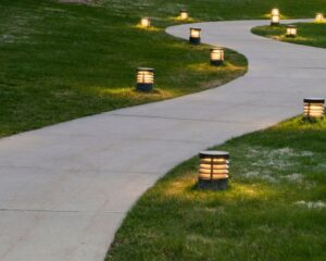 a pathway in the city lit up with several lights.