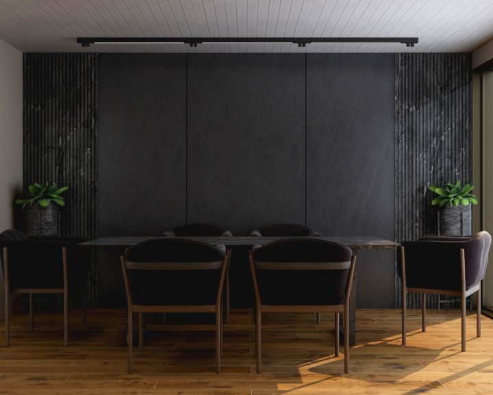 a modern dining room with black concrete walls and wooden floors in the city.