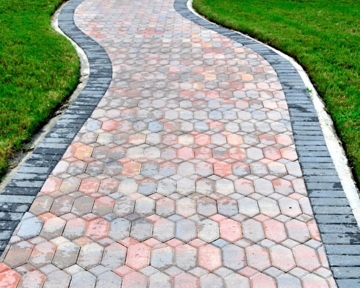 A concrete paver walkway in a city park.